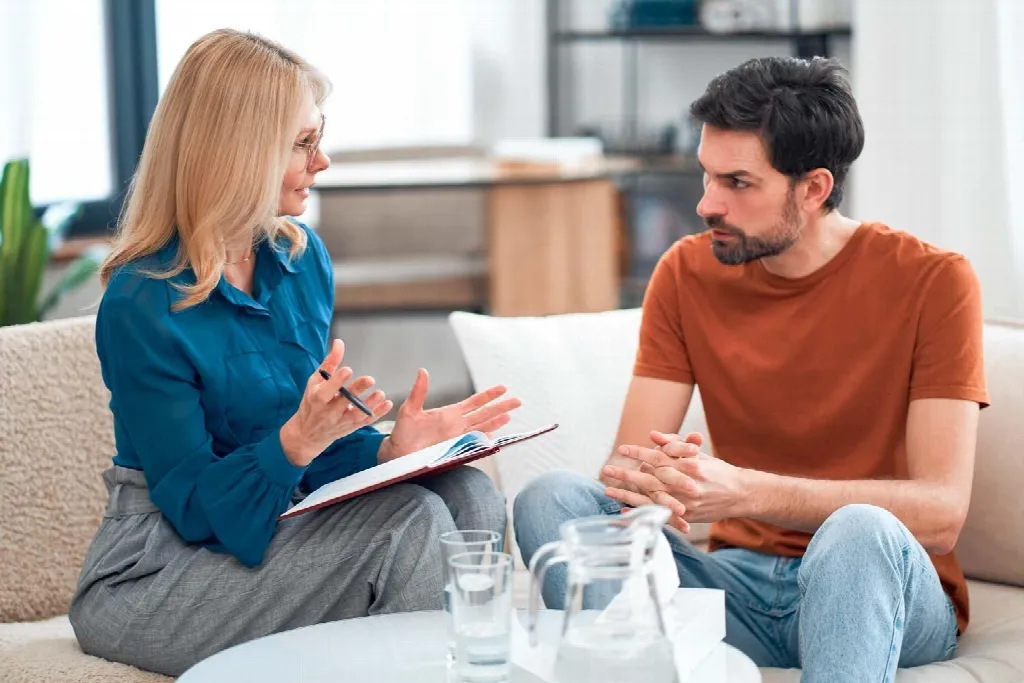 Addiction counselor supporting a person in recovery