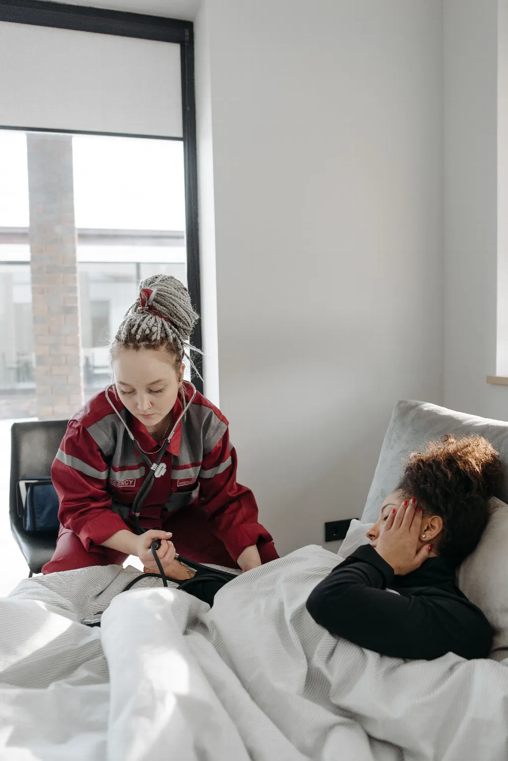 Healthcare professional supporting a person in recovery